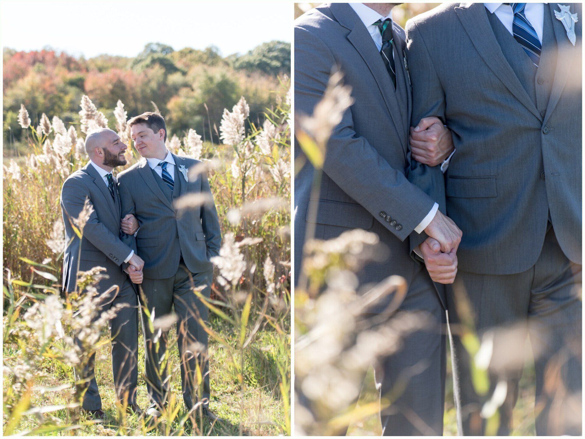 Two people in suits hold hands in a sunlit field of tall grasses.
