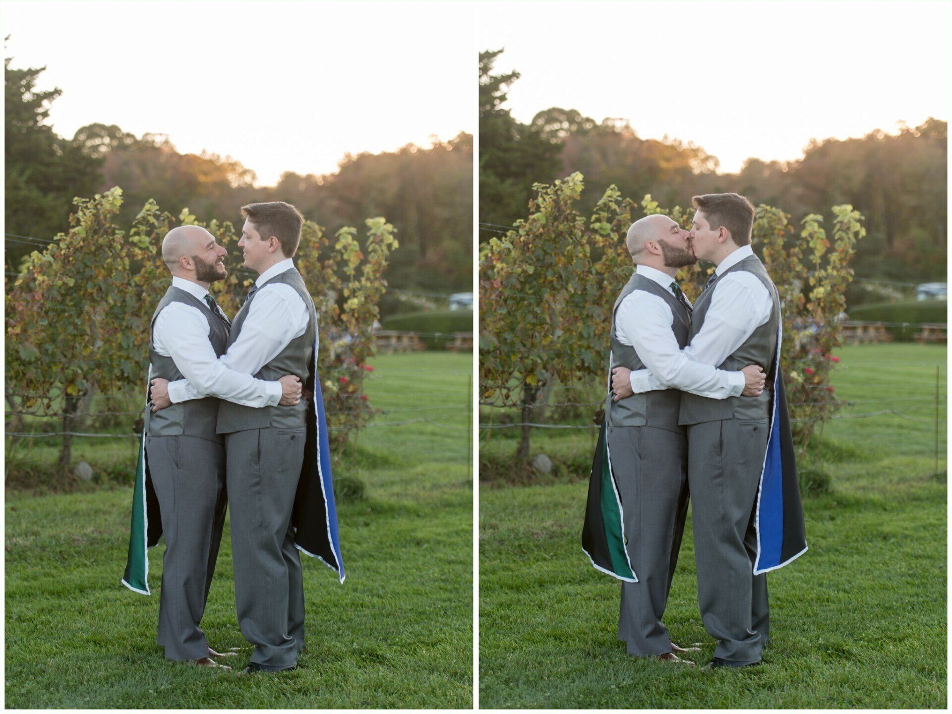 Two people in white shirts and gray pants hugging outdoors on a grassy field at sunset