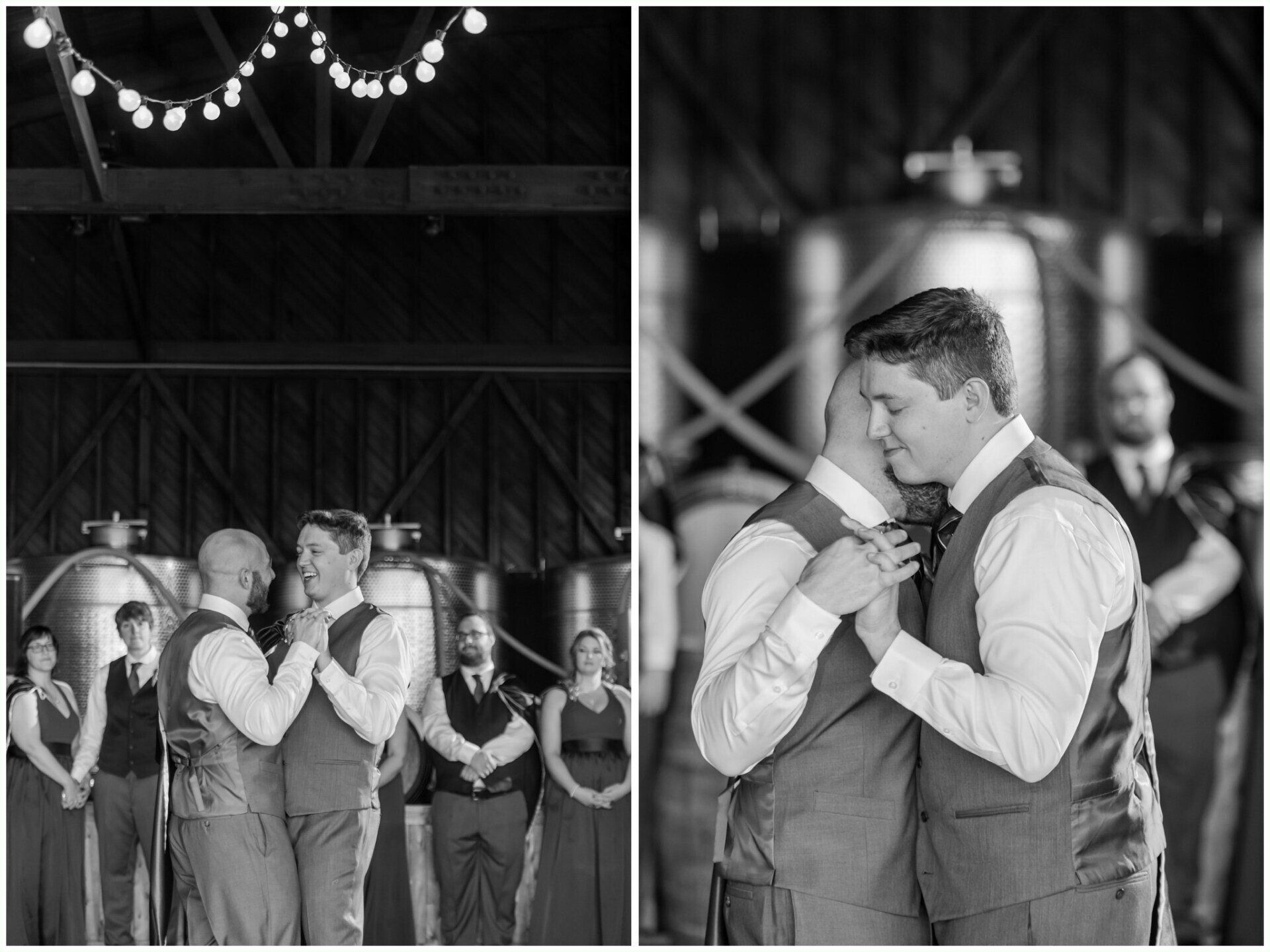 Two men slow-dancing and embracing at a wedding reception in a barn-like venue.