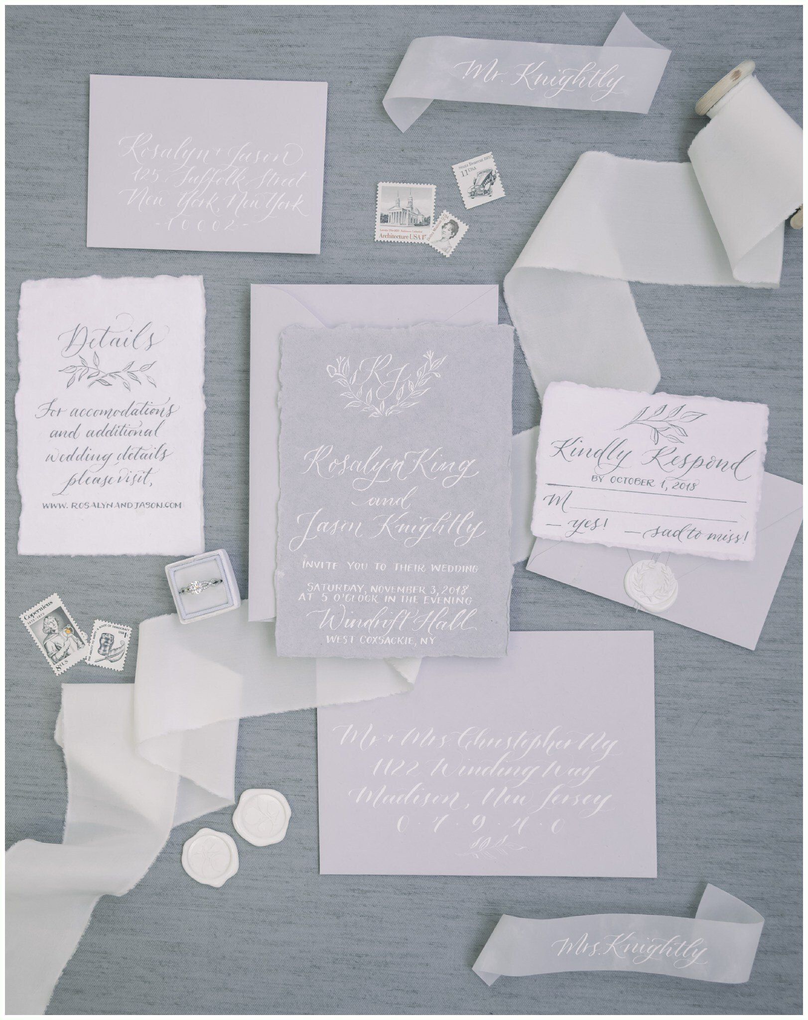 Pastel paper notes and torn scraps arranged on a gray fabric background