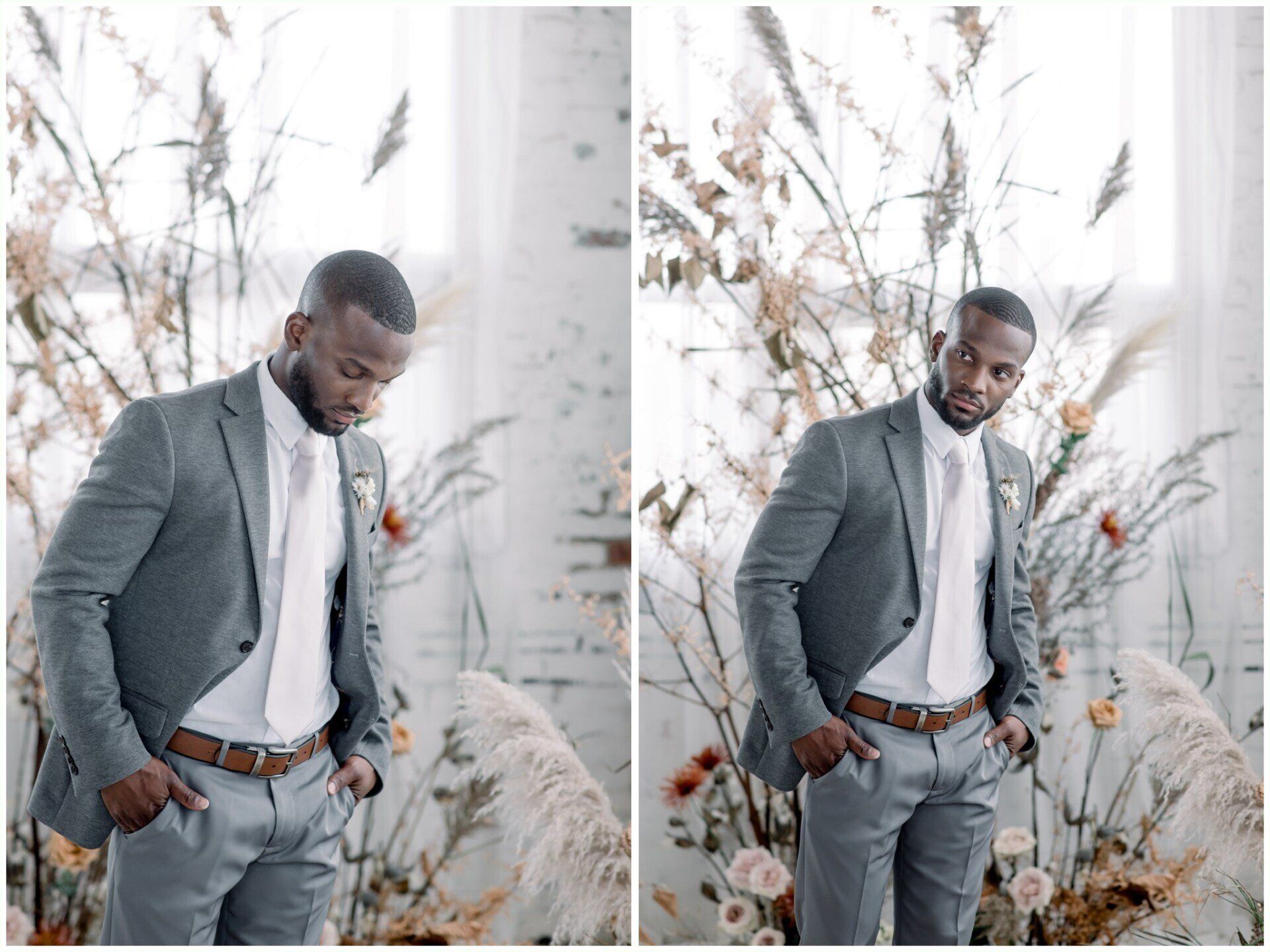 Man in a gray suit posing by white pampas grass against a light wall