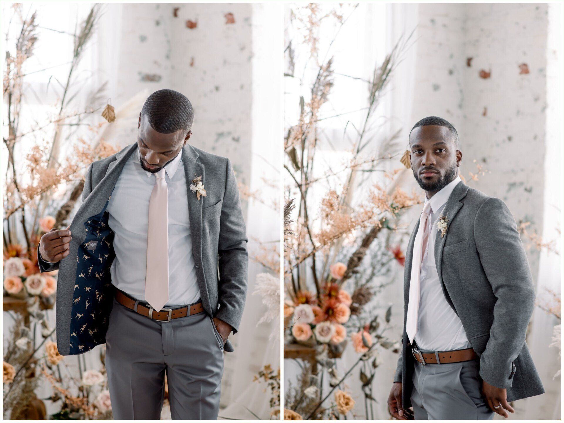 Two men in gray suits posing indoors, one adjusting his jacket beside a floral backdrop.