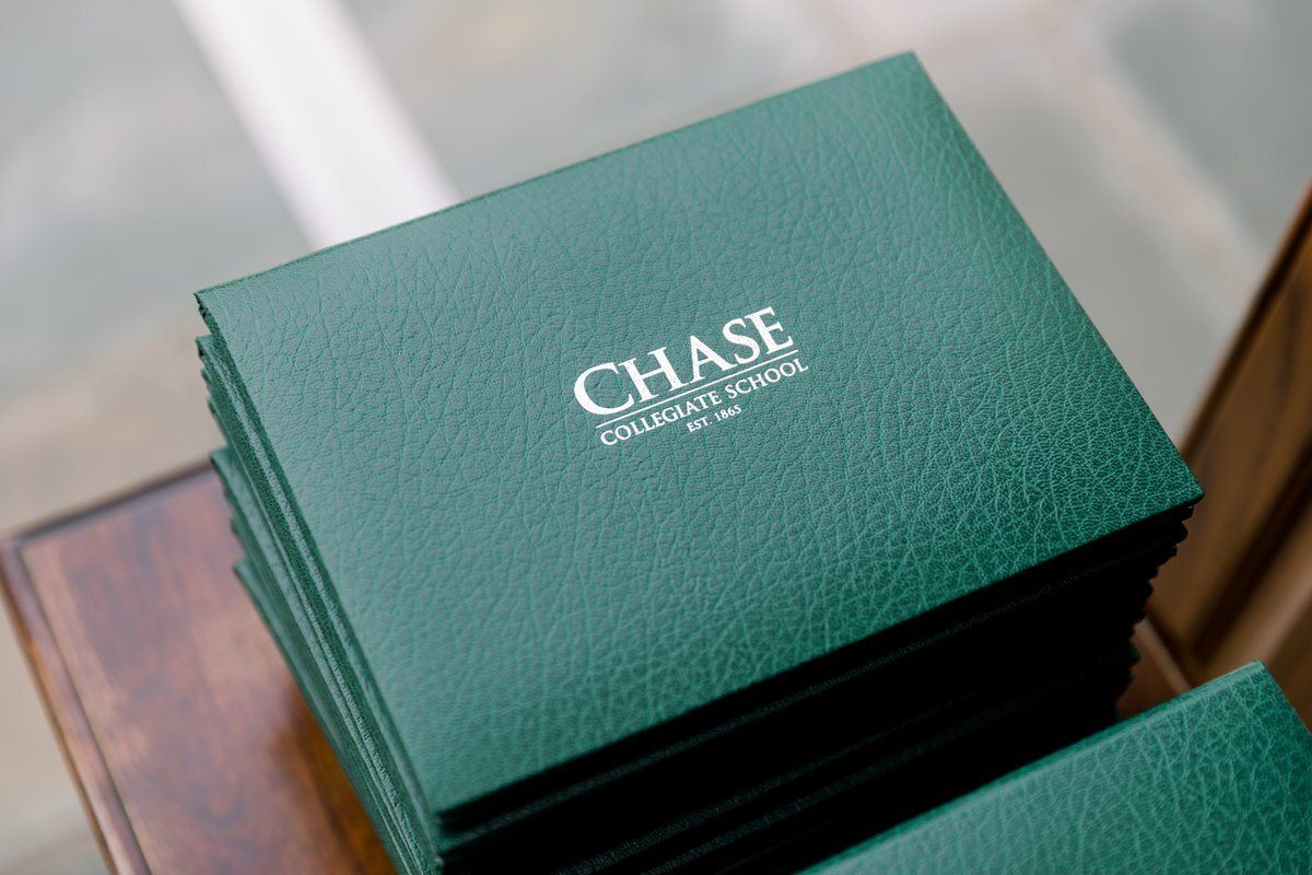 Stack of green Chase-branded cards on a wooden surface
