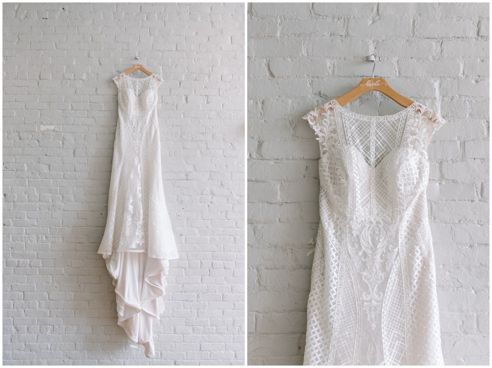 Two white lace wedding dresses hanging on wooden hangers against a white brick wall.