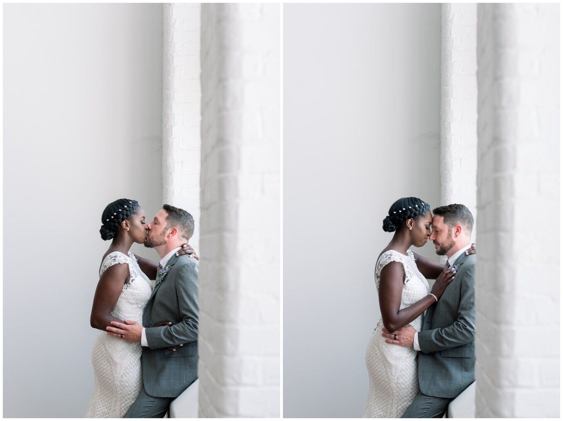 Couple kissing beside white columns in a bright, minimalist setting