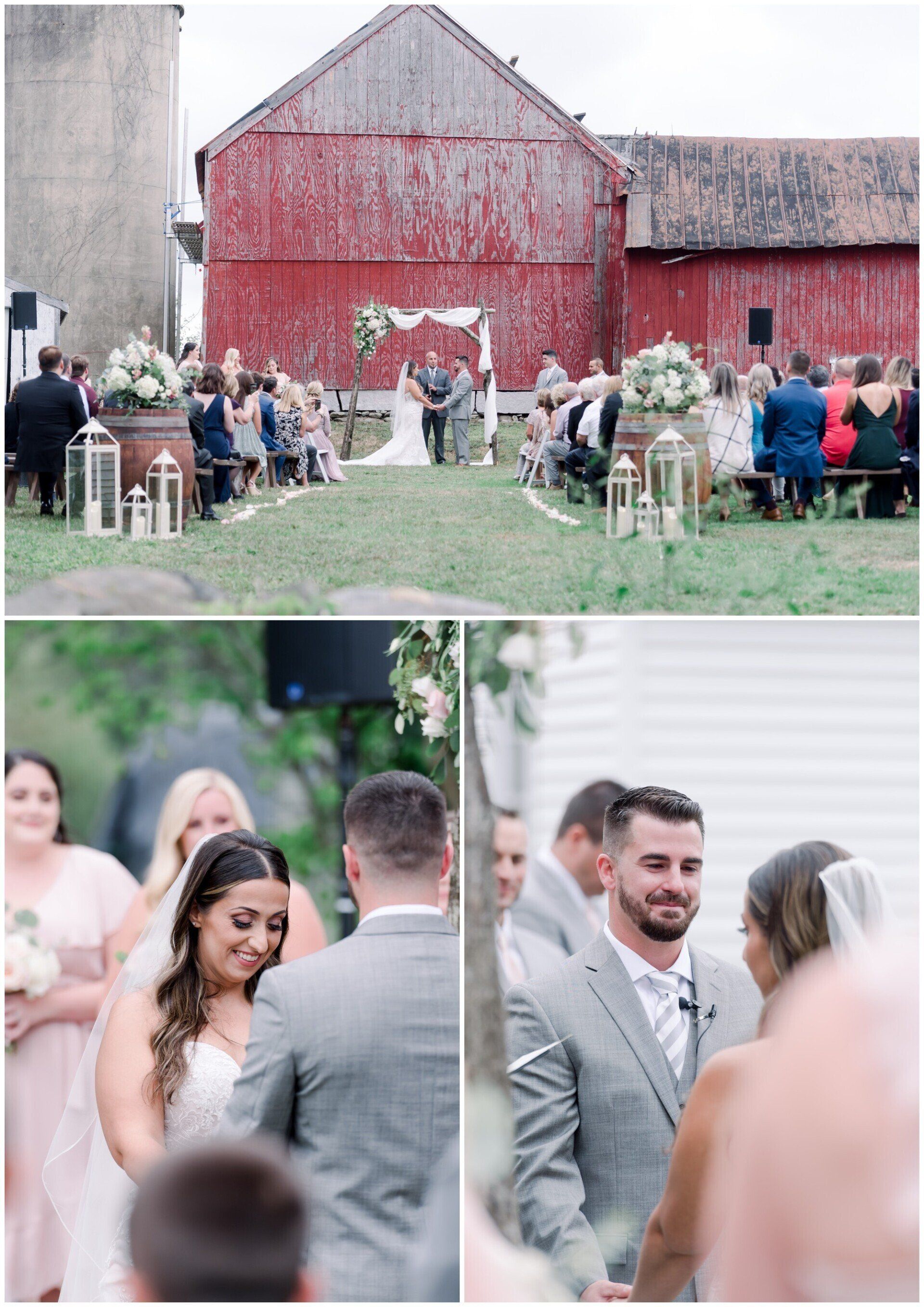 Outdoor wedding ceremony at a red barn, with guests seated and a couple exchanging vows under a floral arch