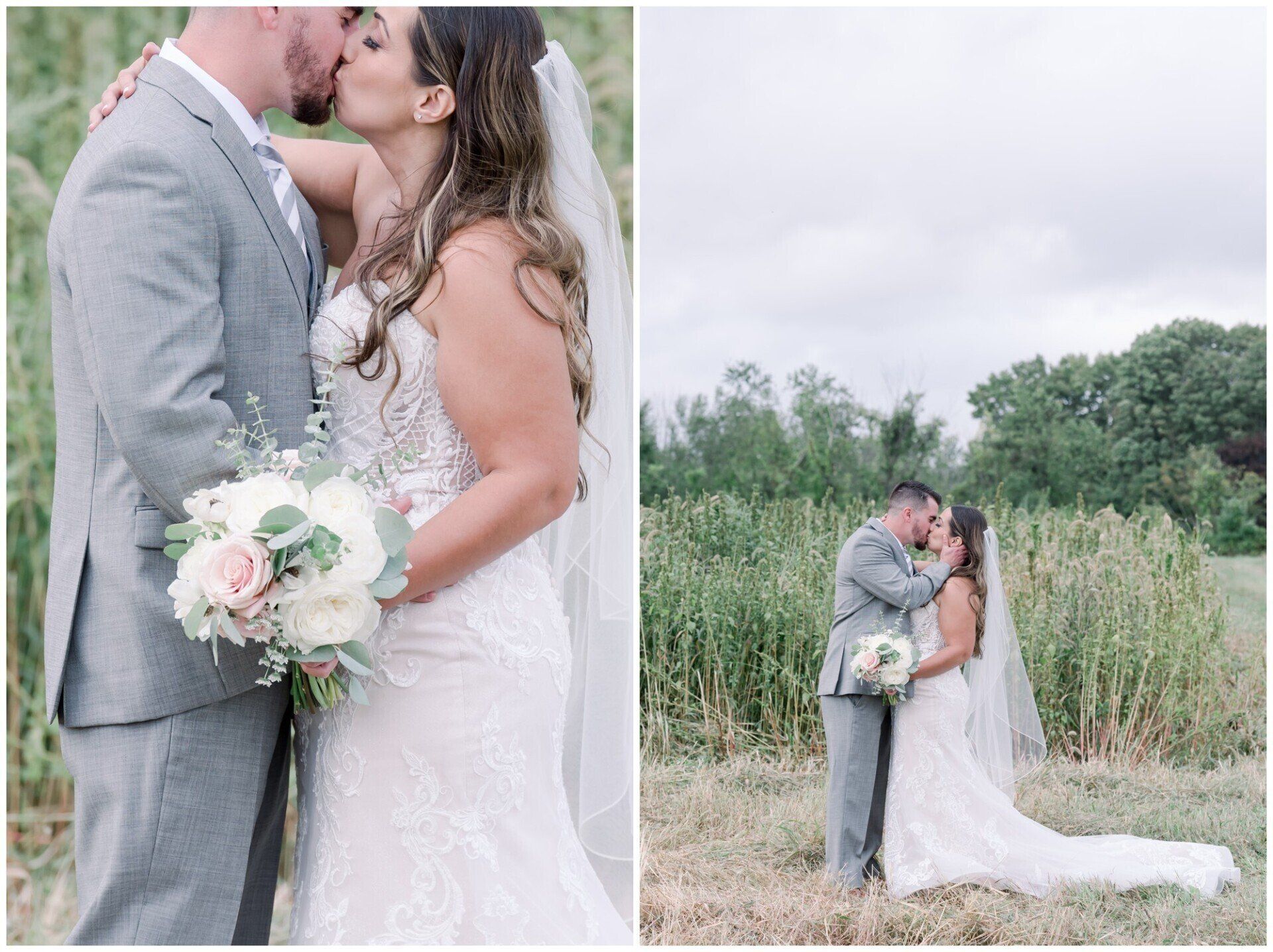 Wedding couple kissing outdoors, groom in gray suit and bride in white dress holding bouquet in a field.
