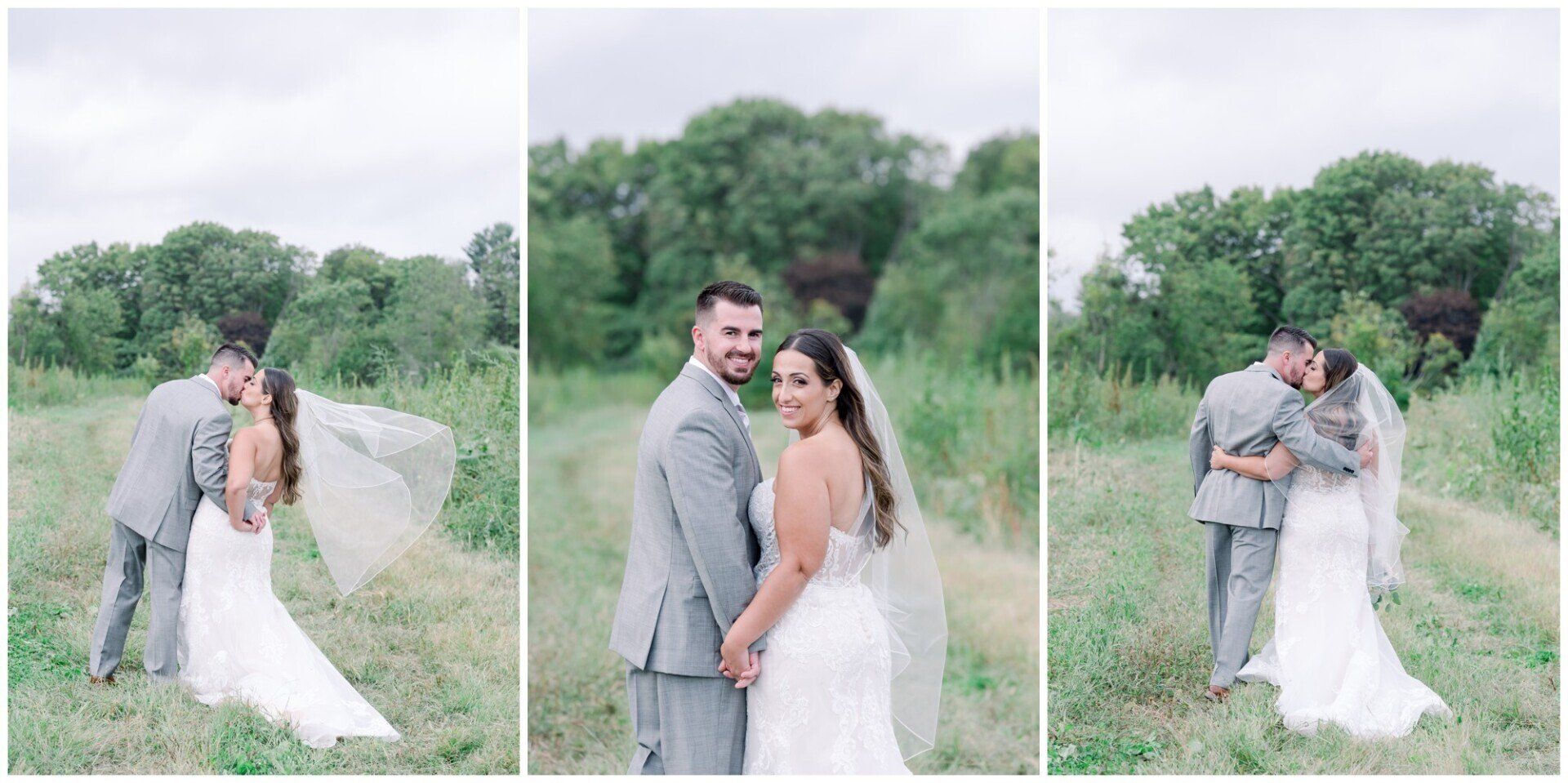 Bride and groom posing and embracing outdoors in a grassy field with trees behind them