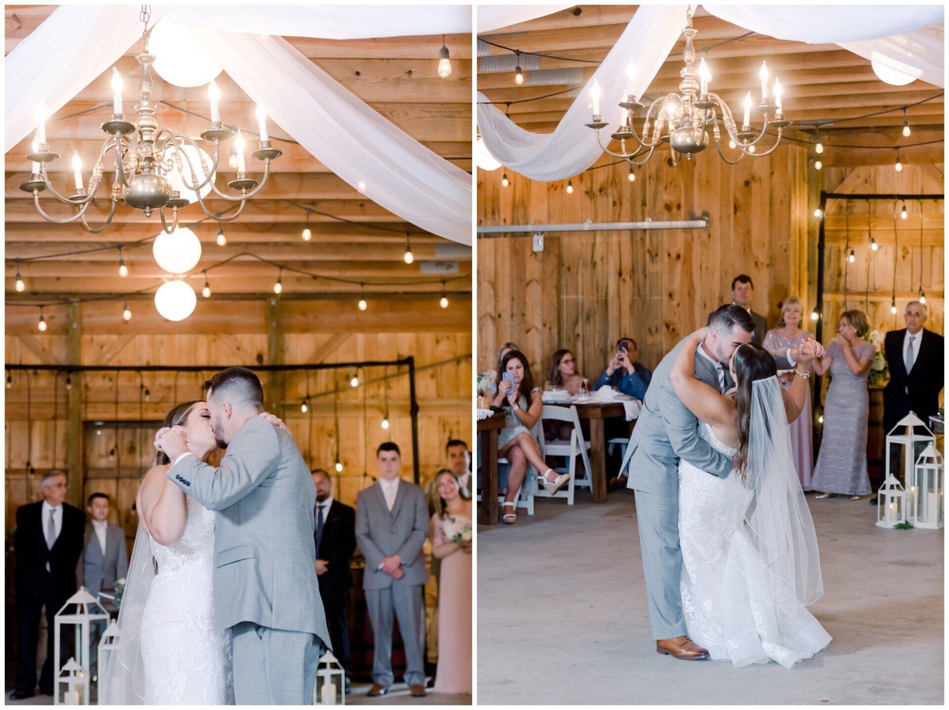 Bride and groom kissing during wedding ceremony in a rustic wooden barn with guests watching