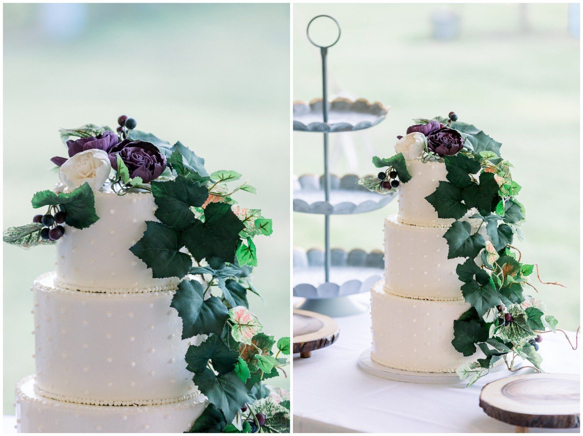 White two-tier wedding cake with green ivy and purple flowers on a dessert table