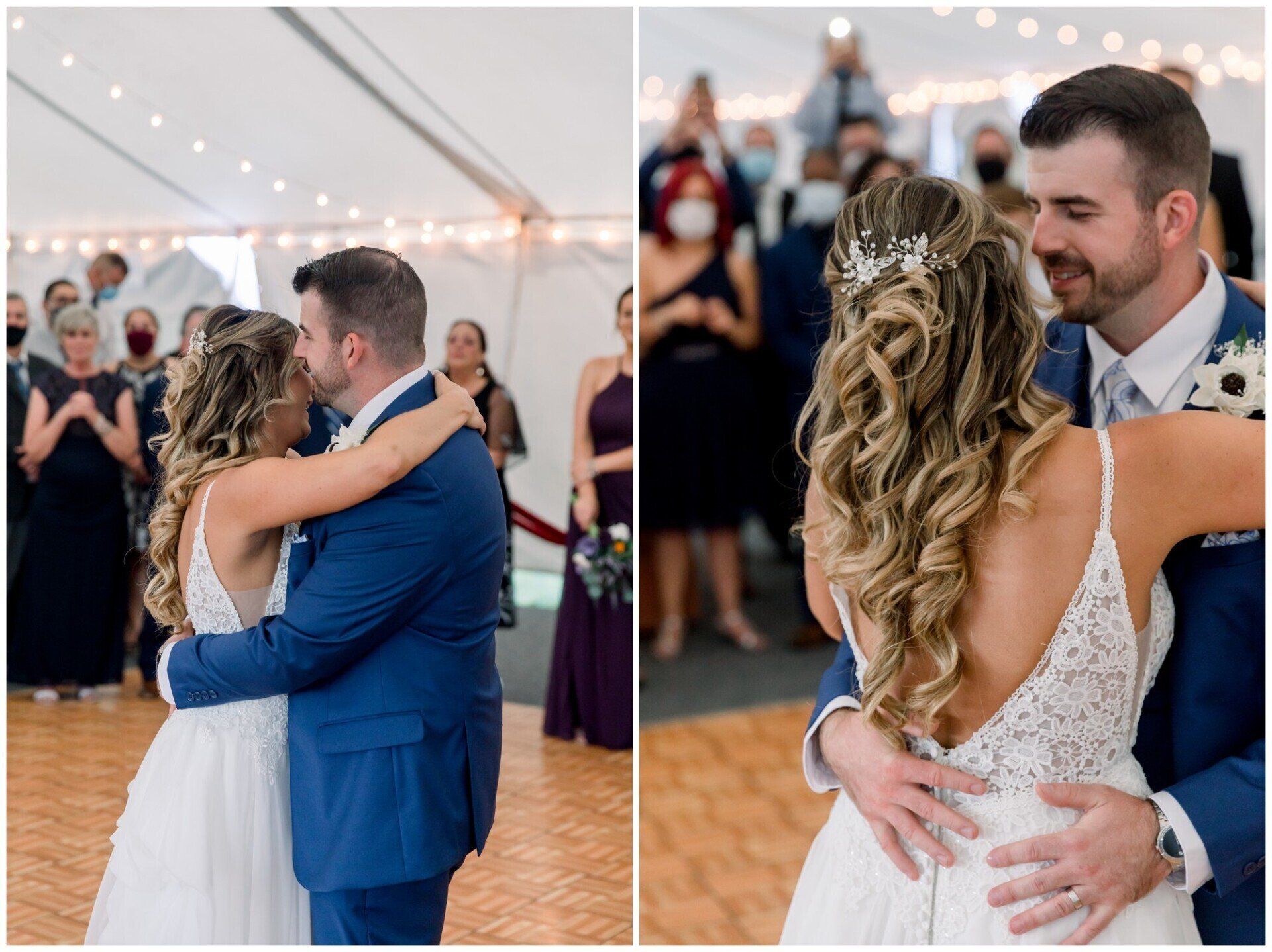 Couple slow dancing at a wedding reception, embracing under a tent with guests in the background.