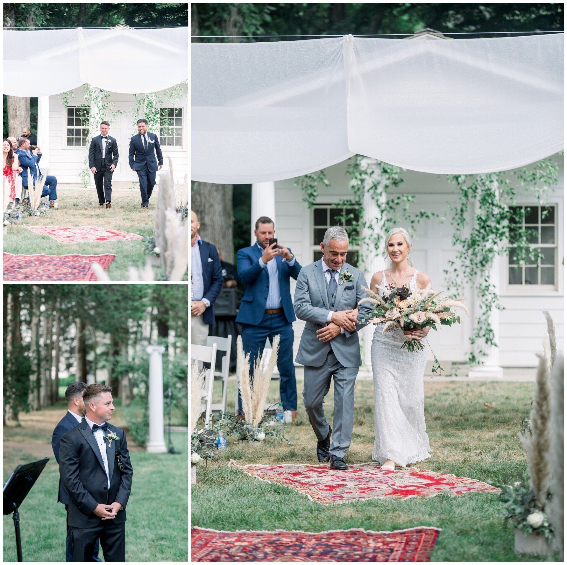 Outdoor wedding procession under a white canopy, with guests walking on a red petal aisle.