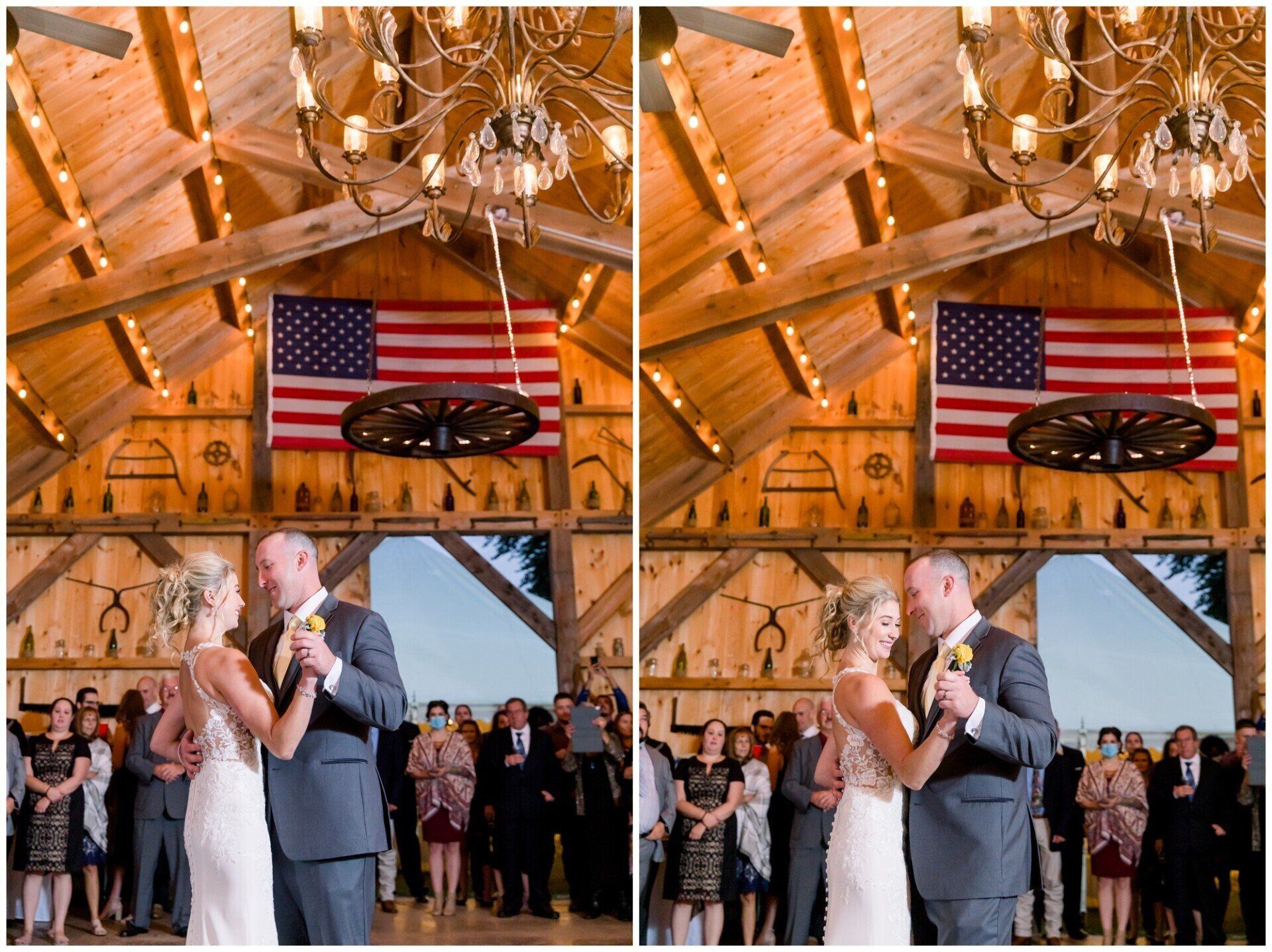 Couple slow dancing at a rustic indoor wedding reception beneath an American flag and wooden beams