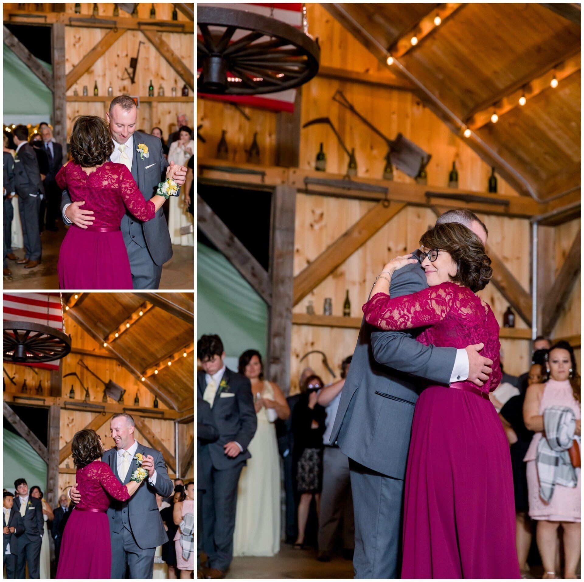 Couple slow-dancing at a rustic indoor reception, with guests watching in the background.
