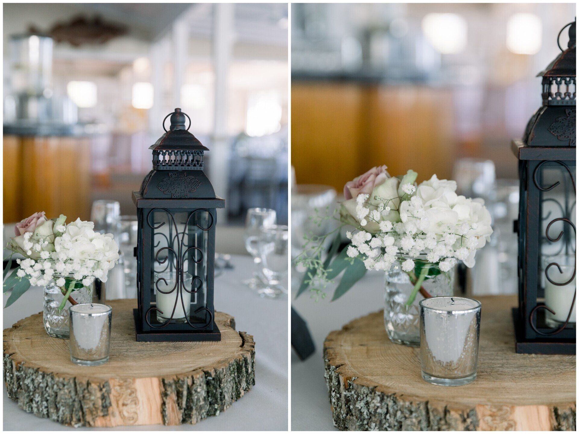 Rustic table centerpiece with black lantern, white flowers, and glass vases on a wood slice.
