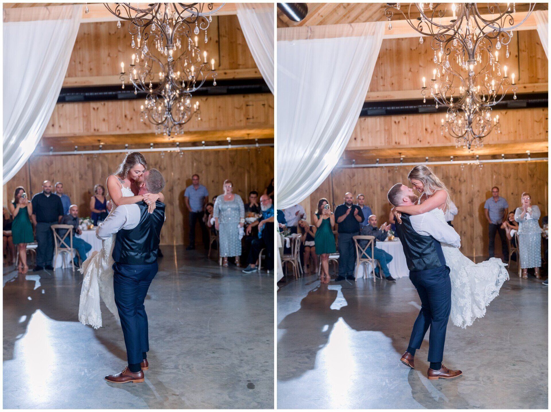 Bride and groom sharing a kiss during their wedding reception beneath chandeliers and white drapes