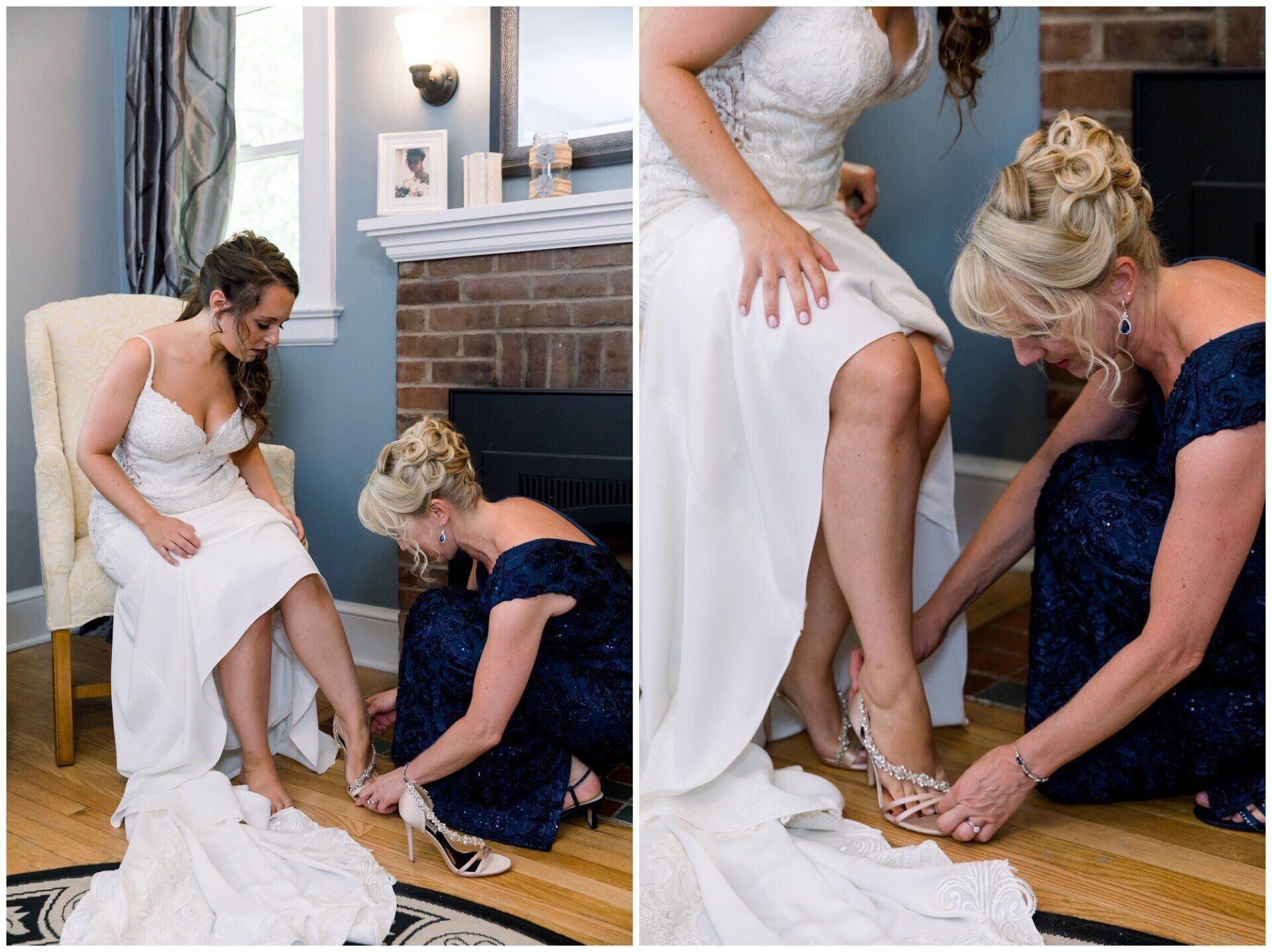 Bride in white dress adjusting shoes while seated, with another woman helping in a living room by the fireplace