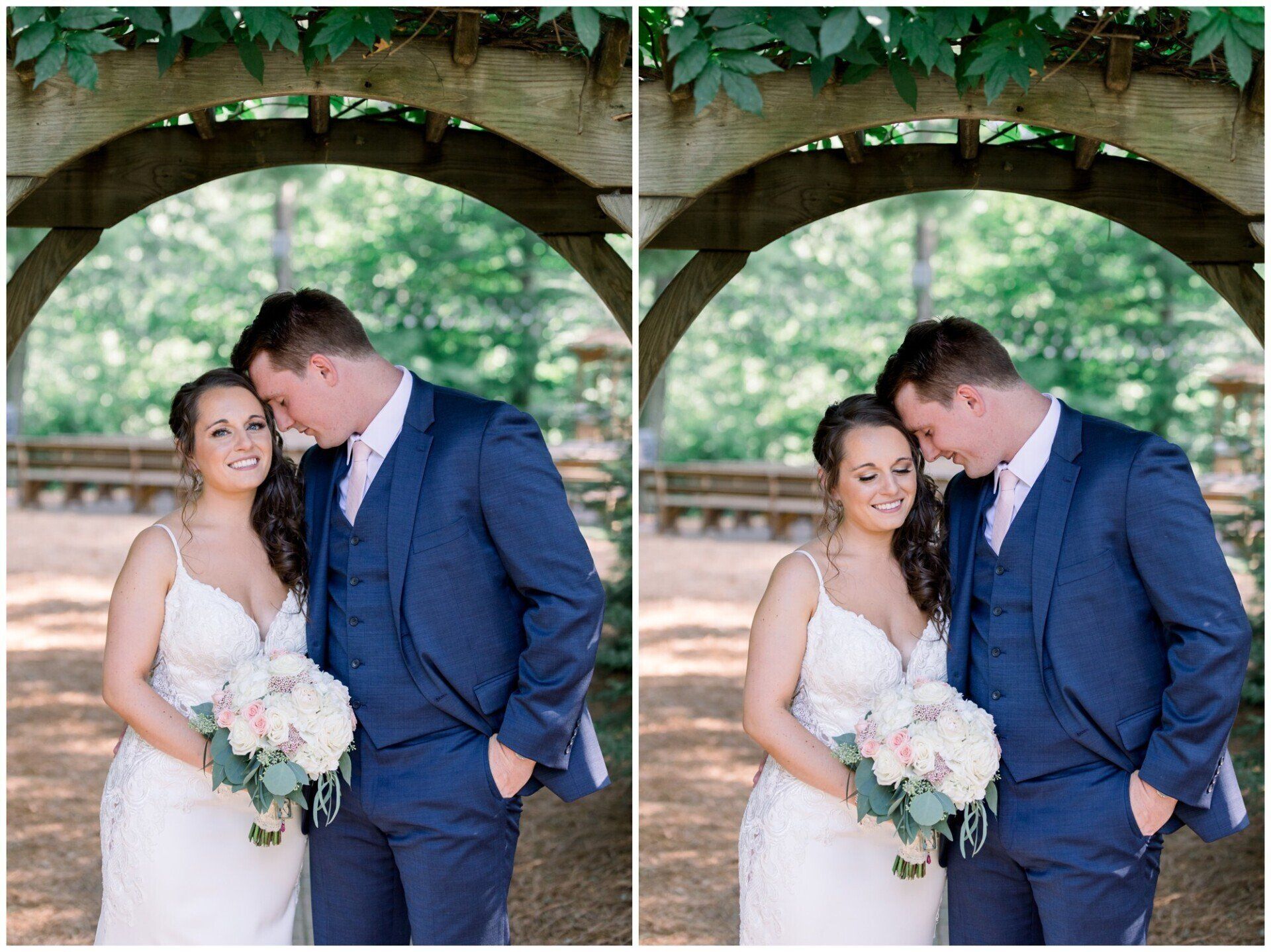 Bride and groom under a wooden arch, smiling with bouquets in a garden setting.