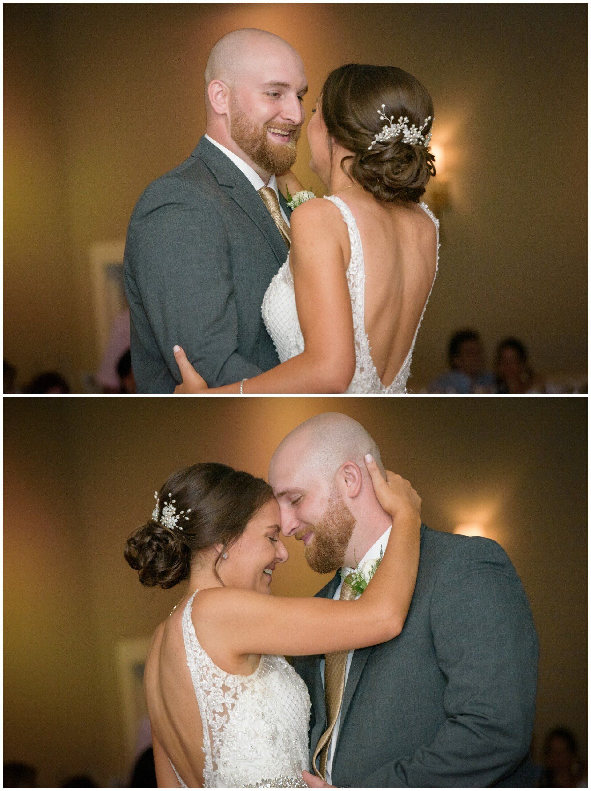 Couple dancing closely at a wedding, with the bride in a white dress and the groom in a gray suit.