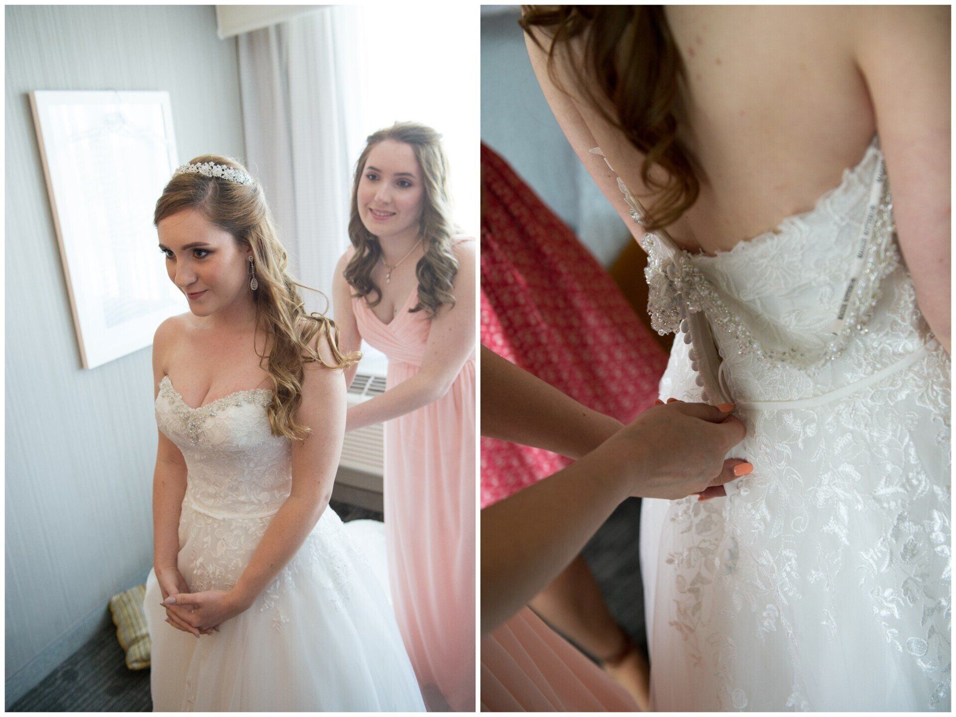 Bride getting dressed in a white lace wedding gown while a bridesmaid helps adjust the back.