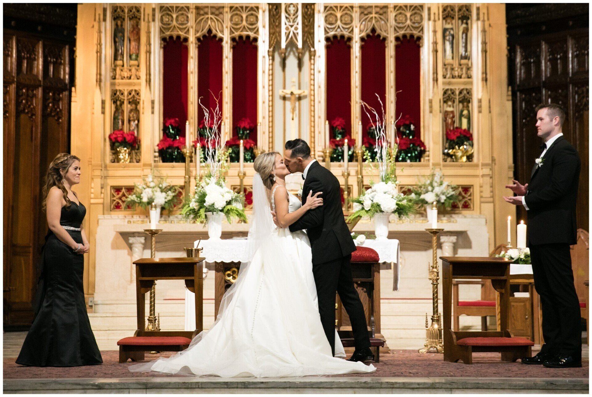 Bride and groom exchanging vows in an ornate church altar with attendants nearby