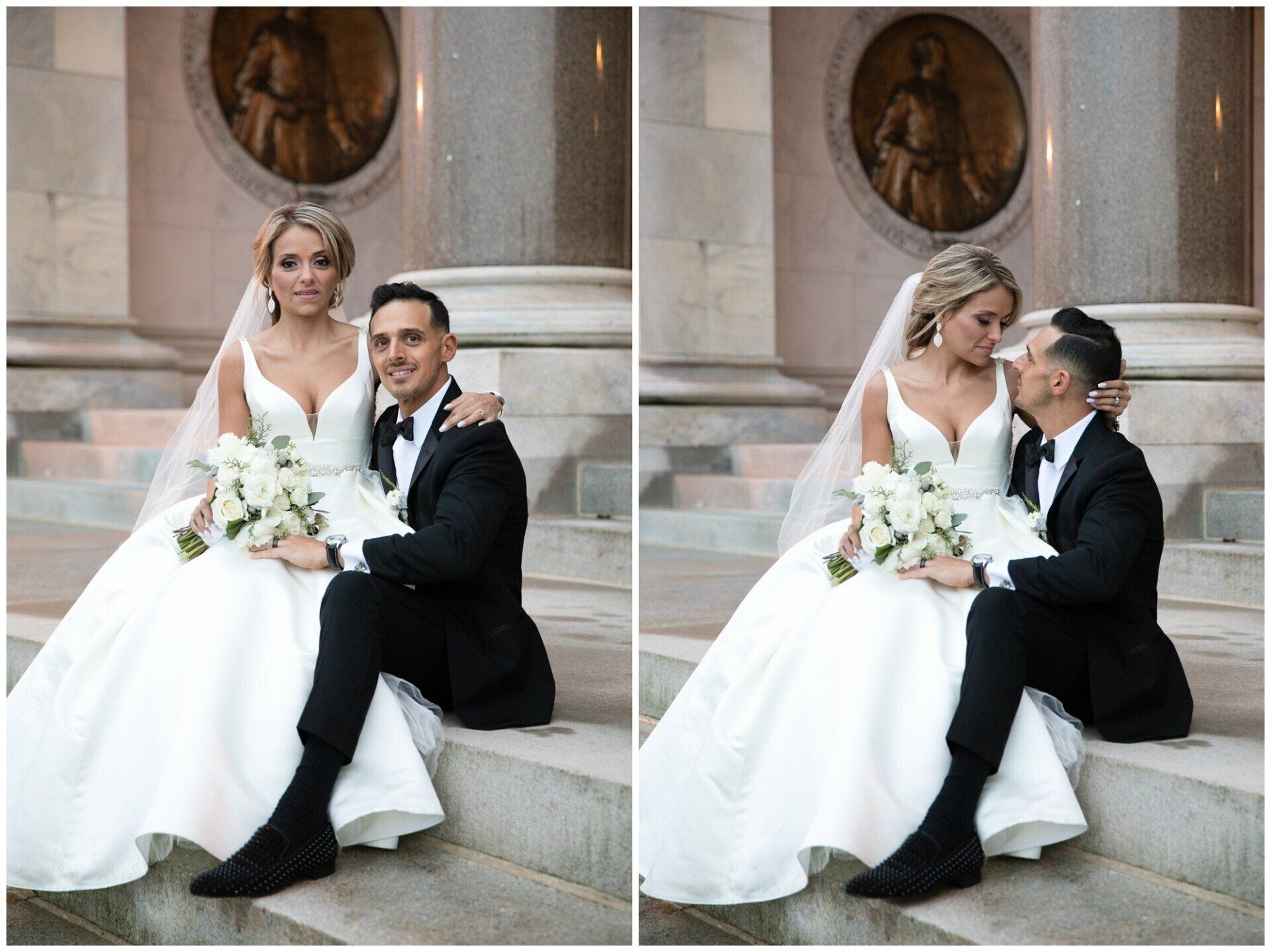 Bride and groom sit on stone steps, smiling and leaning close with a bouquet in front of a carved wall.