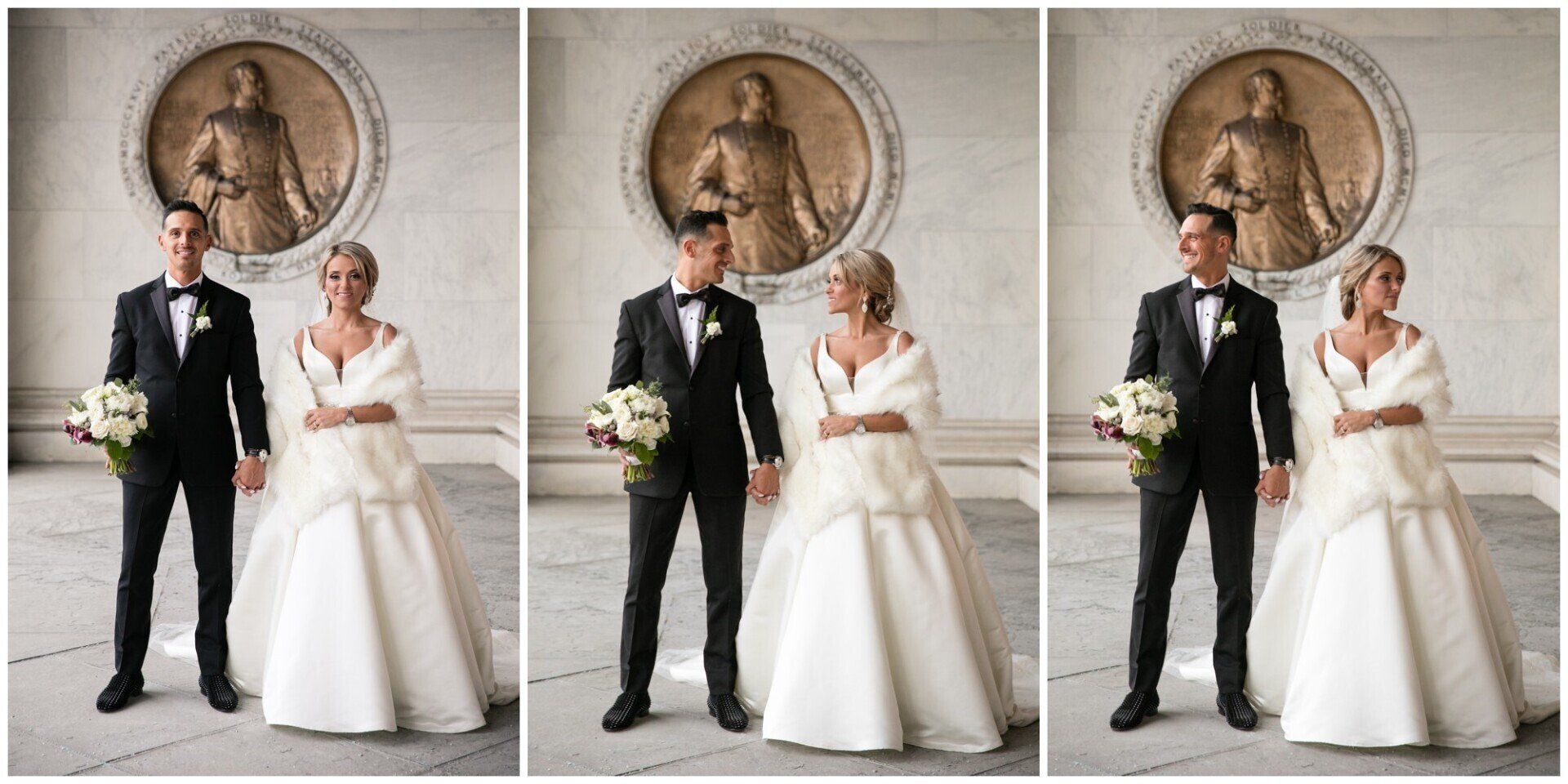 Wedding couple posing indoors in formal black tuxedo and white gown before a large wall medallion