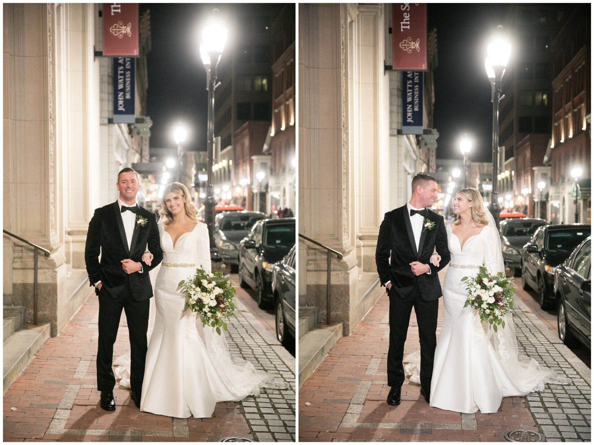 Bride and groom posing on a lit city sidewalk at night with a bouquet and wedding attire