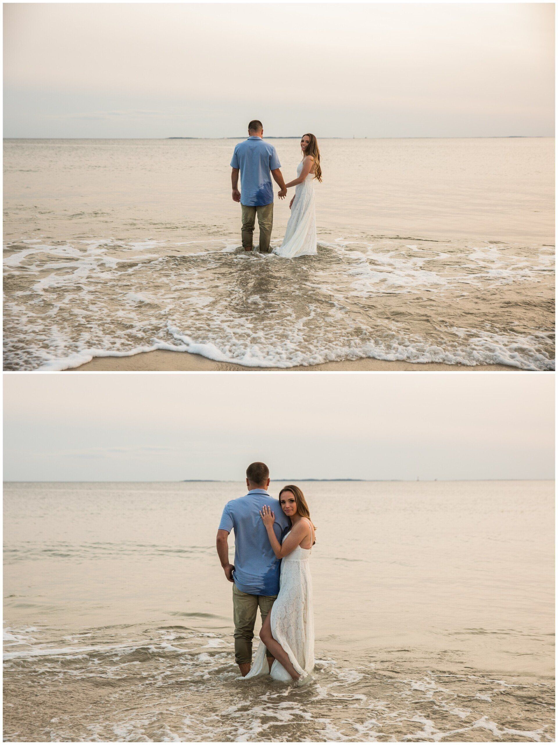 Couple on a beach at sunset, standing in shallow waves and embracing near the shoreline.