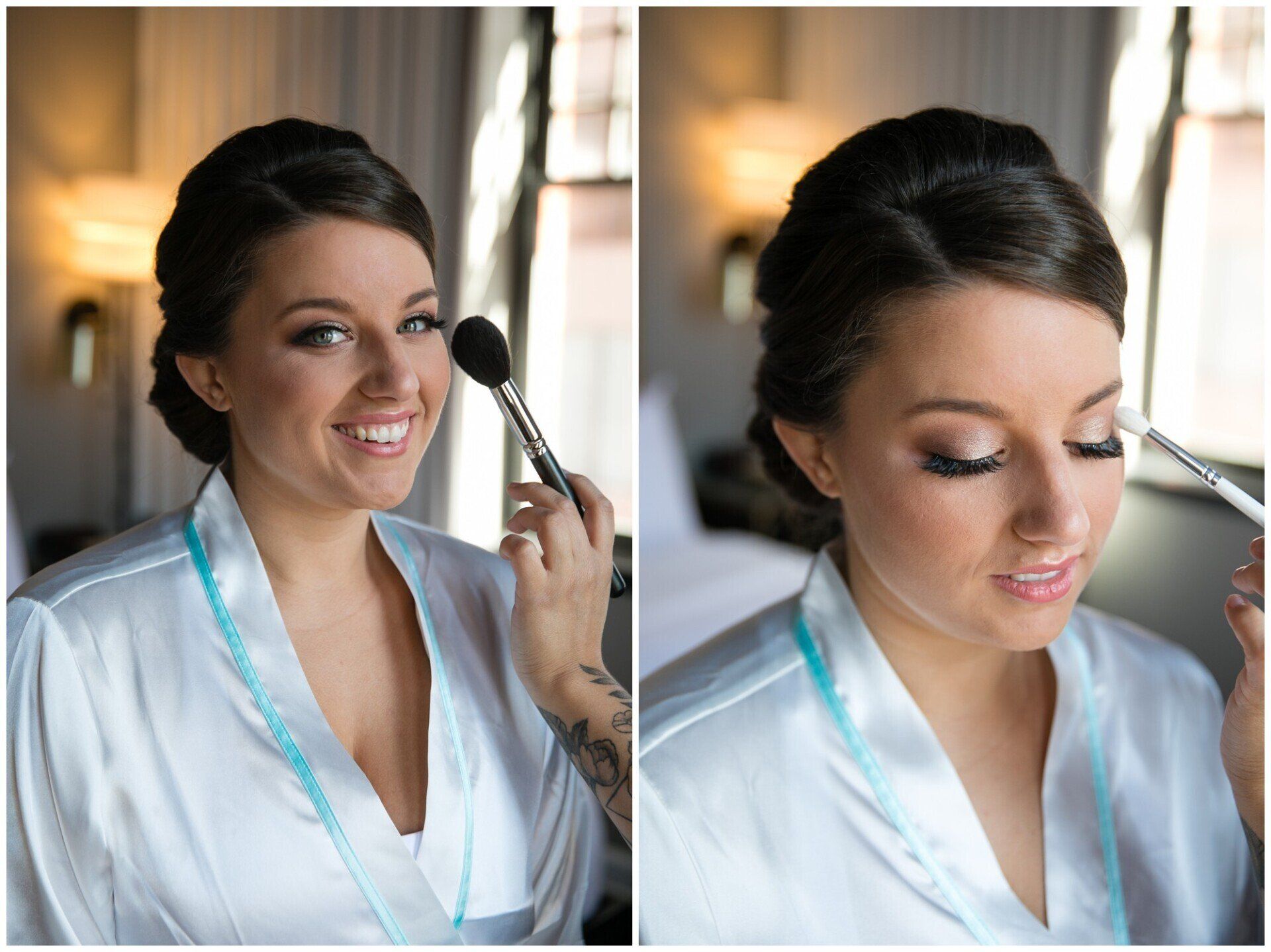 Bride in white robe getting makeup applied, smiling in a softly lit room.