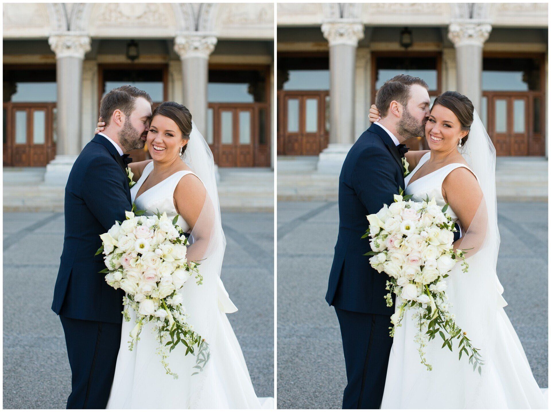 Bride and groom embracing in front of a building, holding a white bouquet