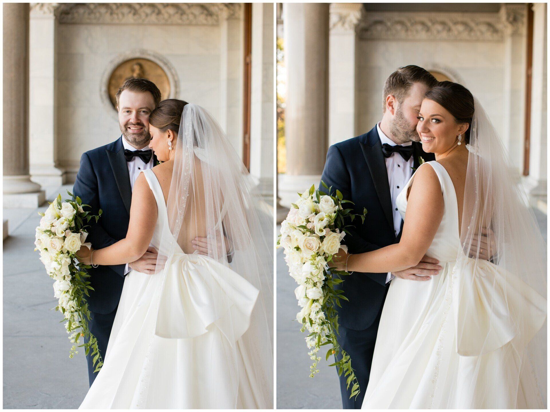 Bride and groom embrace in a bright ornate room, holding white bouquets and facing each other in wedding attire