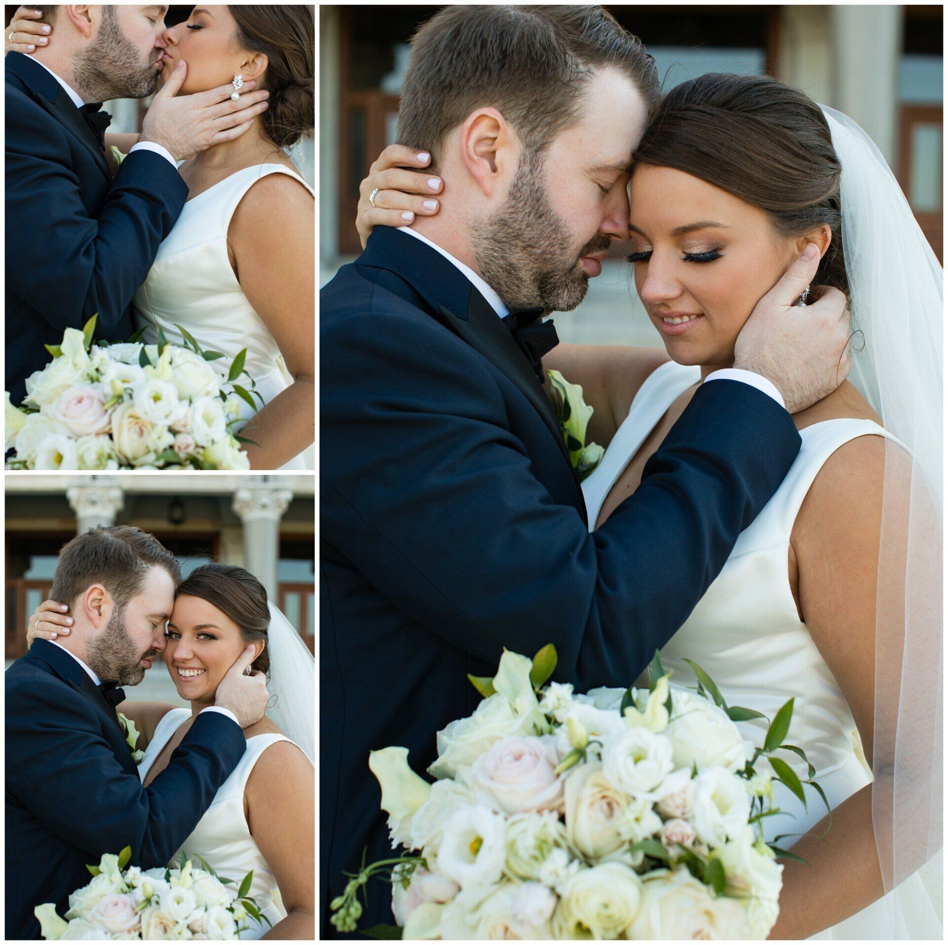 Bride and groom share an intimate wedding kiss, holding a white bouquet indoors.