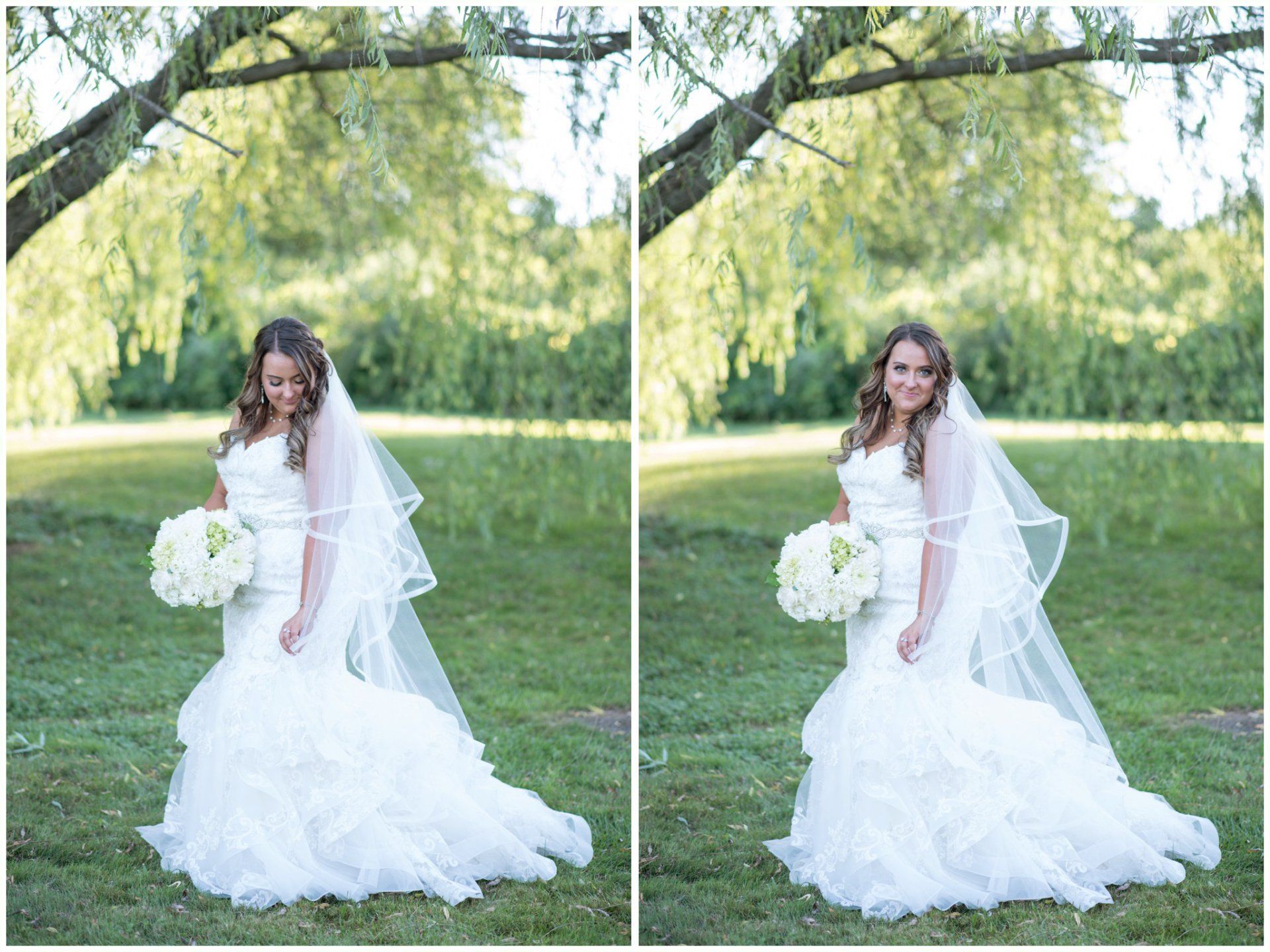 Bride in a white gown holding a bouquet, standing on grass beneath trees.
