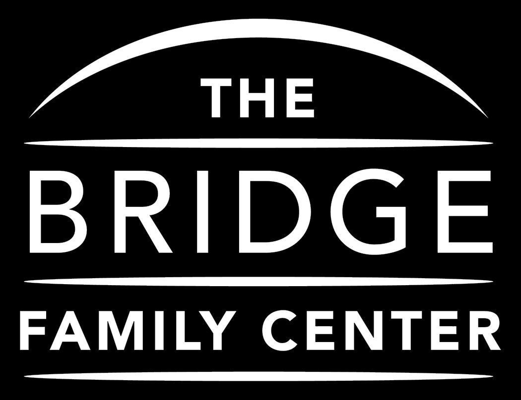 Black logo reading “THE BRIDGE FAMILY CENTER” with a white bridge arc above and horizontal lines