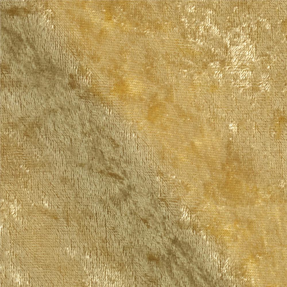 Abstract textured background in gold and beige tones with soft, mottled patterns.