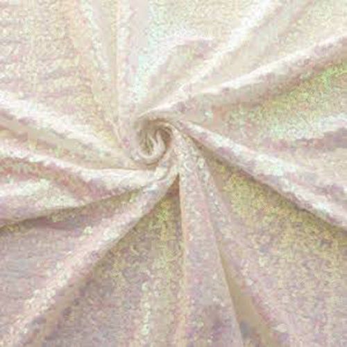 Pale pink satin fabric gathered into a spiral fold pattern