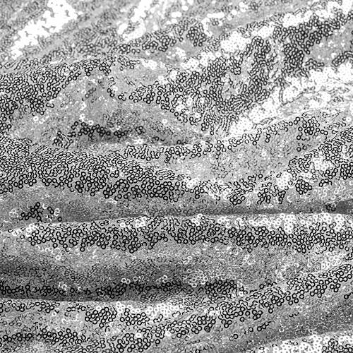 Abstract black-and-white textured pattern with horizontal streaks and dotted grain.