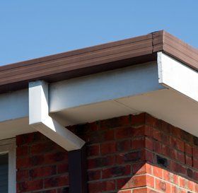 Man cleaning a flat roof