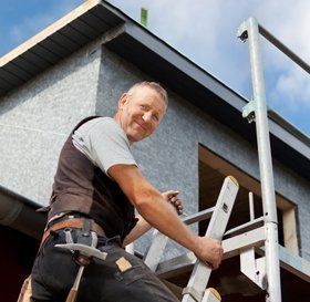 Man cleaning a flat roof