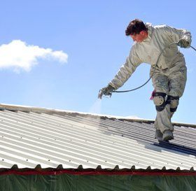 Man cleaning a flat roof