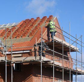 Man cleaning a flat roof