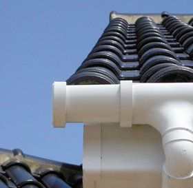 Man cleaning a flat roof