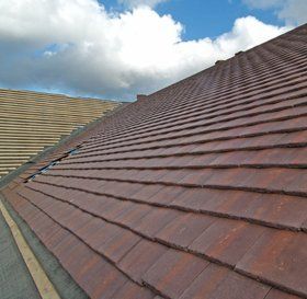 Man cleaning a flat roof