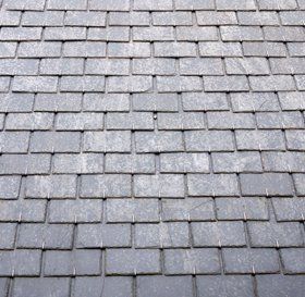 Man cleaning a flat roof