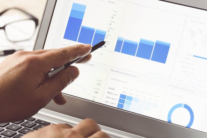 Person Viewing Graph on Digital Display