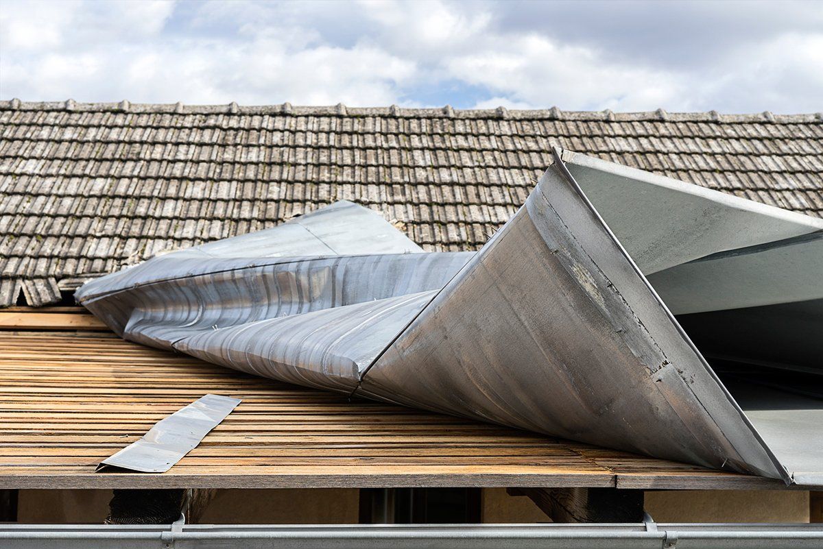 Metal Roof Top Demolished By Wind — Panama City, FL — Raven Environmental Restoration Services