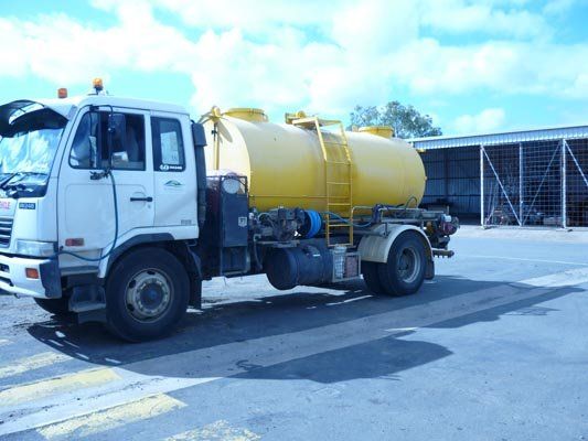 water truck with yellow tanks