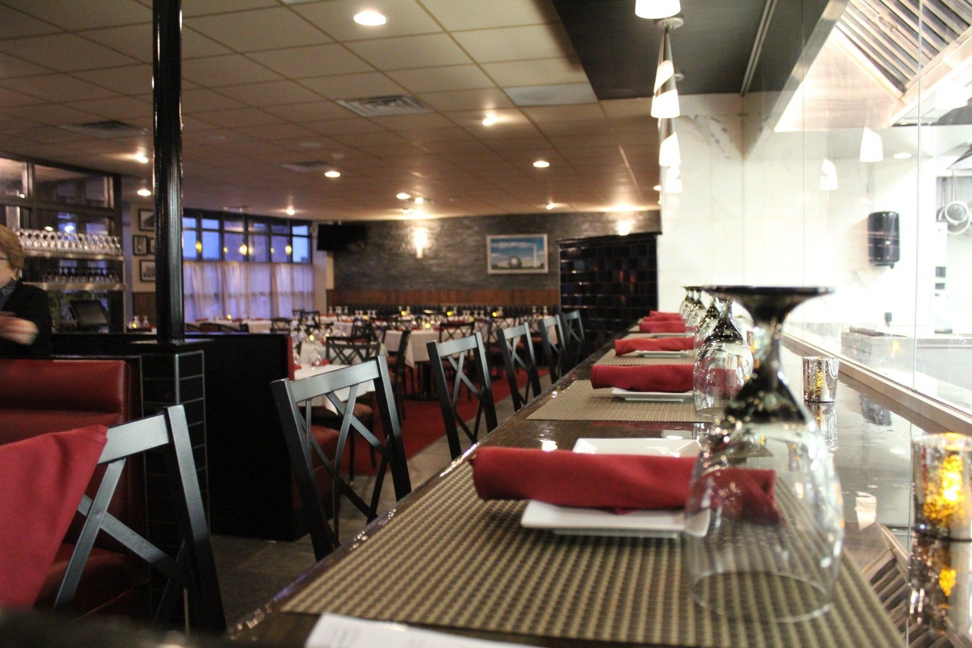 A restaurant with a lot of tables and chairs