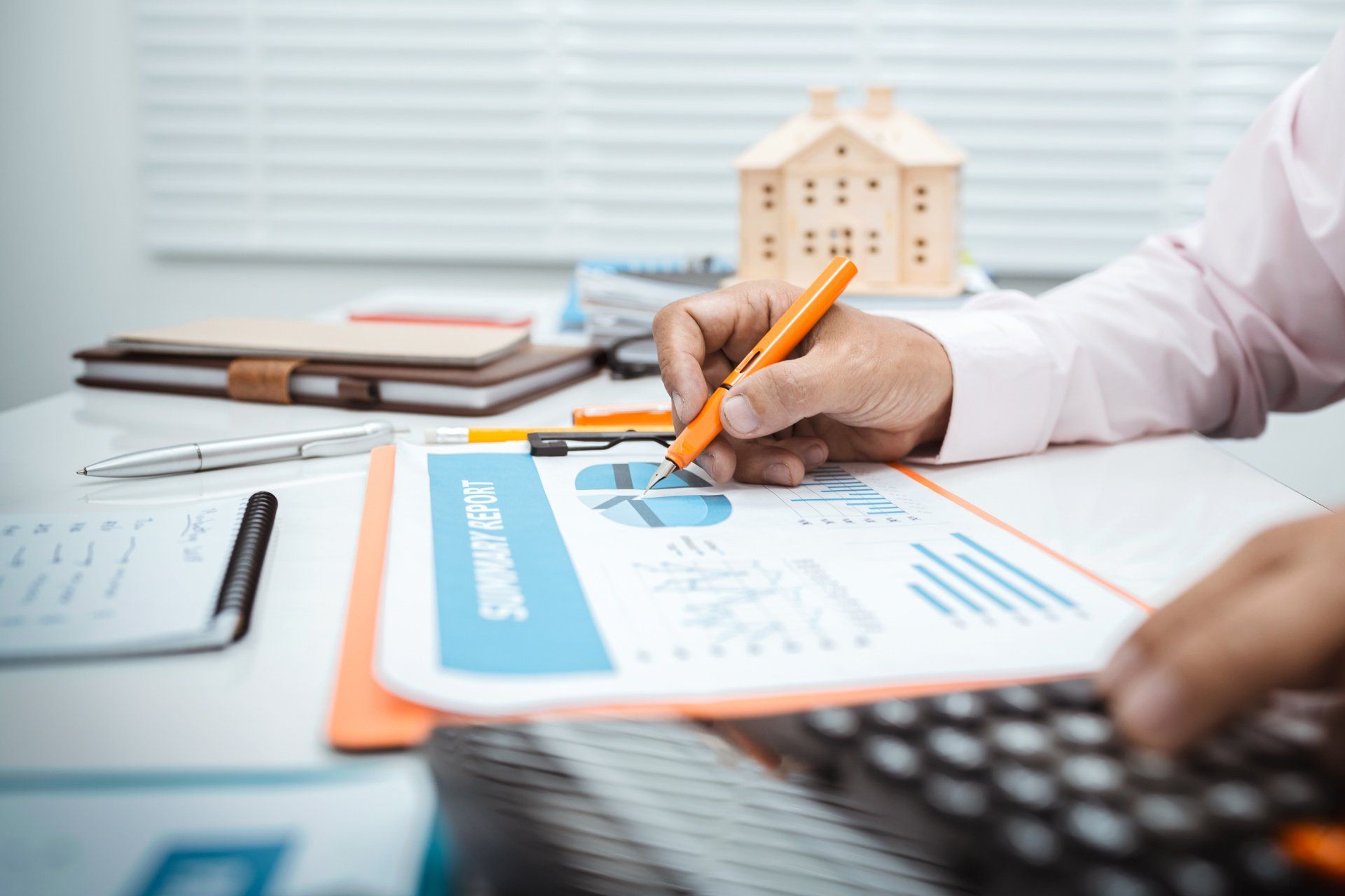 financial man in white shirt with pen